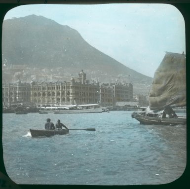 Dezső Bozóky Hong Kong Harbour: Queen's Building, Central waterfront, and Kowloon Ferry Pier 1908 Hand‐coloured glass slide H. 8 x W. 8 cm Hong Kong University Museum and Art Gallery, Hong Kong